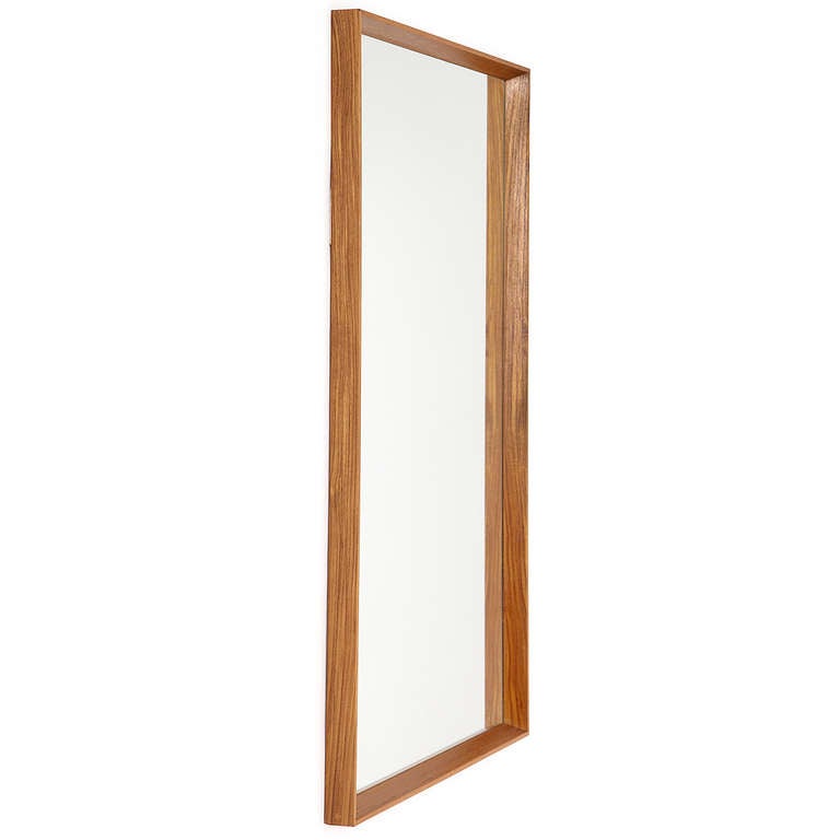A precise and beautifully fabricated miter-cut thin edged mirror made of teak. This mirror can be hung vertically or horizontally.