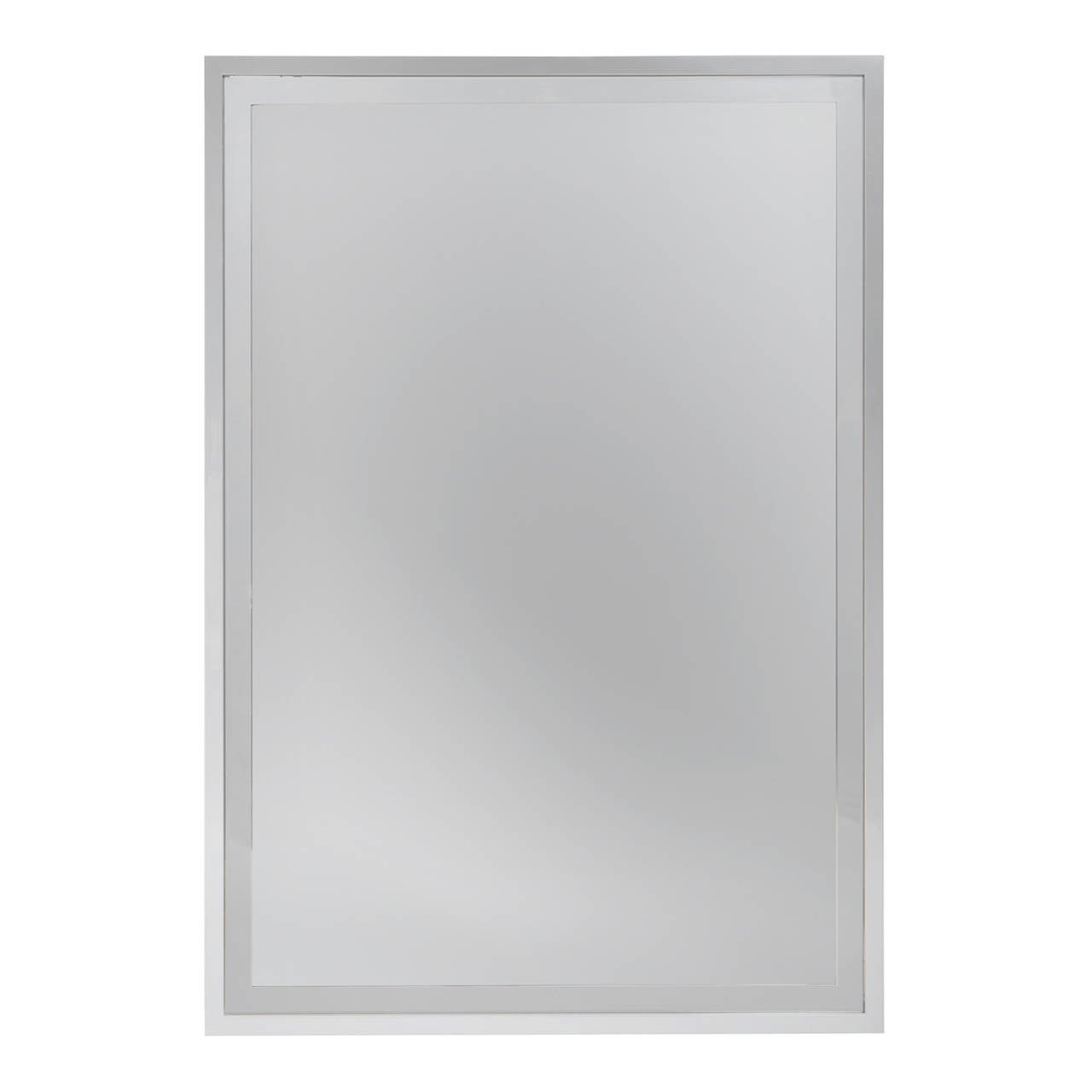 A substantial and superbly rendered rectangular chromed wall mirror having a distinctive frame within a frame detail.