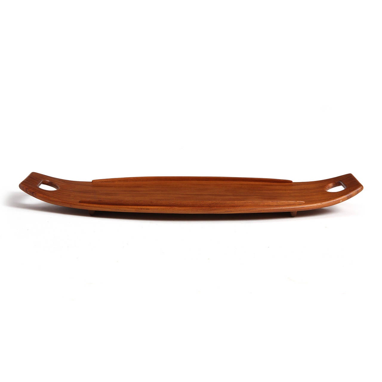 An oblong, wood railed serving tray with upturned ends and cut out handles made from staved planks.