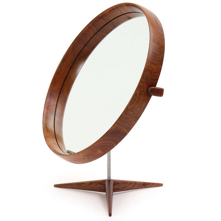 An uncommon and beautifully crafted adjustable vanity mirror in highly figured walnut having a tripod base and a satin chrome stem. Made by Luxus