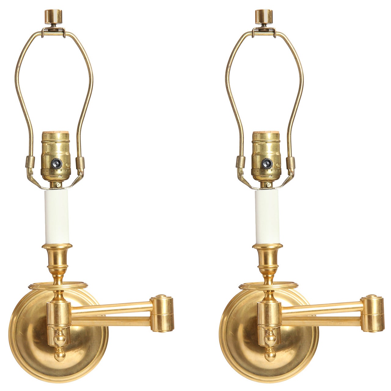 A Pair of Brass Swing Arm Wall Sconces