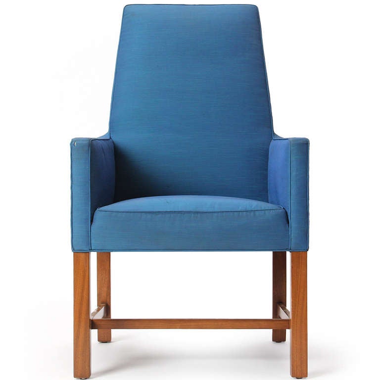A pair of 'Janus' high back chairs with the original blue silk faille upholstery, on light walnut legs with cloud lift stretchers.