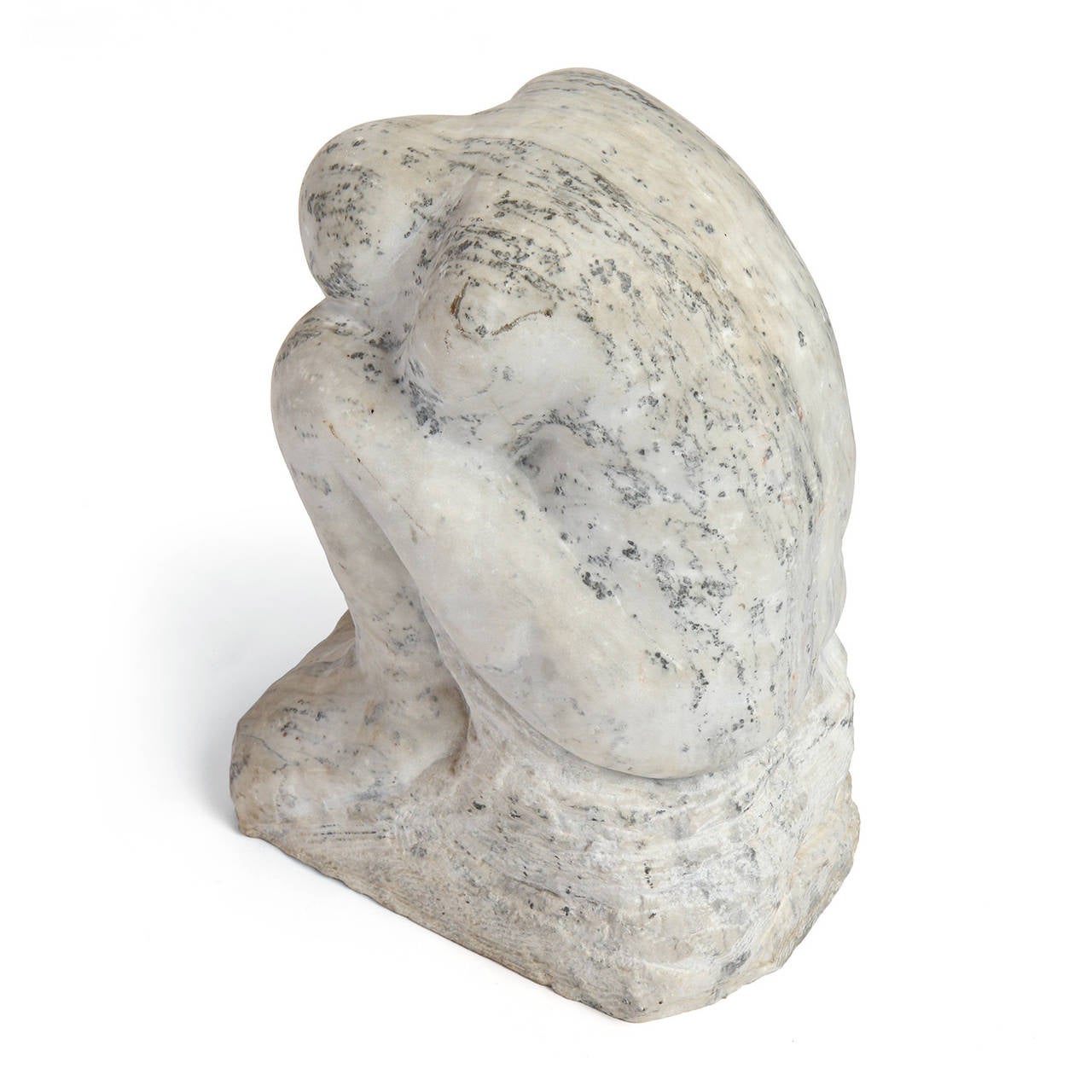 A soulful and finely rendered sculpture of an abstracted crouching figure carved from a single block of richly figured marble.