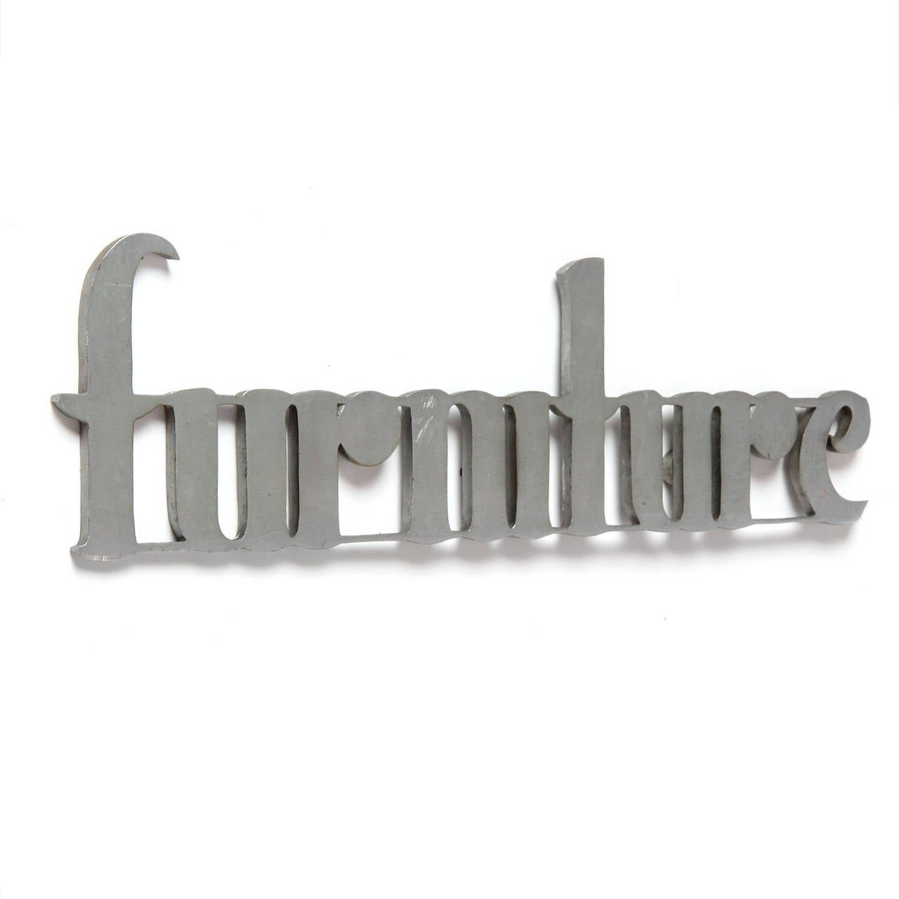 A delightful, substantial and graphic furniture store sign in a lower case Art Deco font crafted of die cut steel.