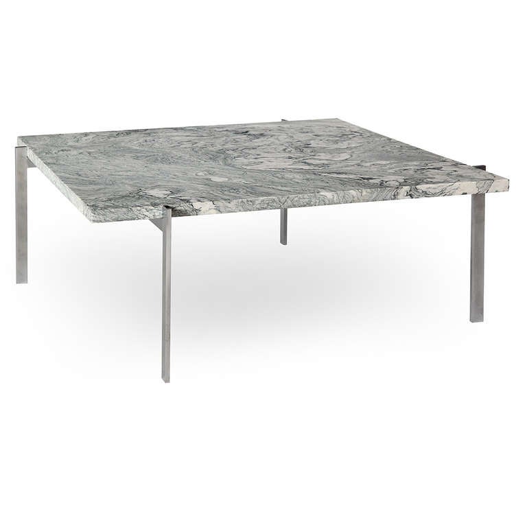 A minimalist low table having an architectural brushed chromed steel base supporting a top of highly figured cippolino marble. This table is from the early production by E. Kold Christensen.