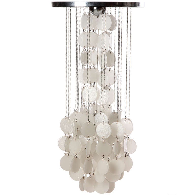 A chandelier with rows of translucent Murano milk glass discs cascading with a round chromed canopy.