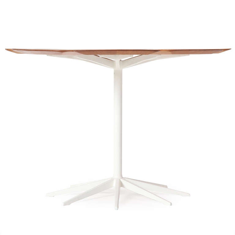 A Mid-Century Modern 'petal' dining table designed by Richard Shultz. This table features a flower-like pine top on a white enameled eight-point cast iron pedestal base. Manufactured in the USA by Knoll, circa 1960s.