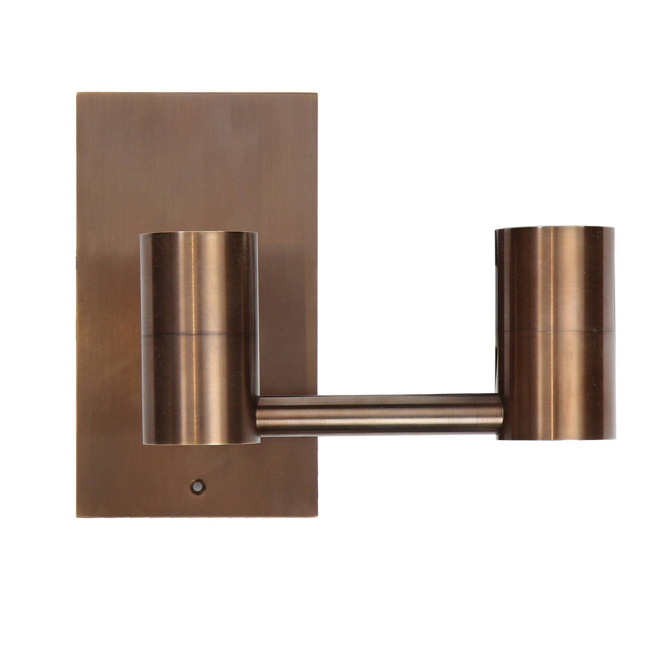 An impeccably made double arm wall sconce having a spare architectural form, crafted of solid brass. Available in polished, brushed, patinated or blackened finishes. Lead time 4-8 weeks. Made by the Wyeth Workshop in Brooklyn, NY.