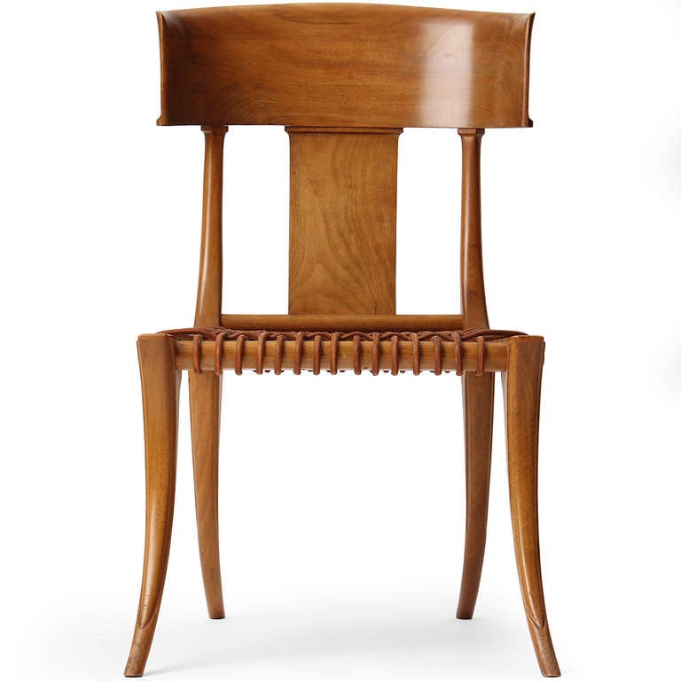 Fascinated and inspired by the Classical furniture of Greece, T.H. Robsjohn-Gibbings based the design for this beautiful Klismos chair on his study of the form found painted on ancient amphora vases. In the early 1960s he collaborated with the Greek