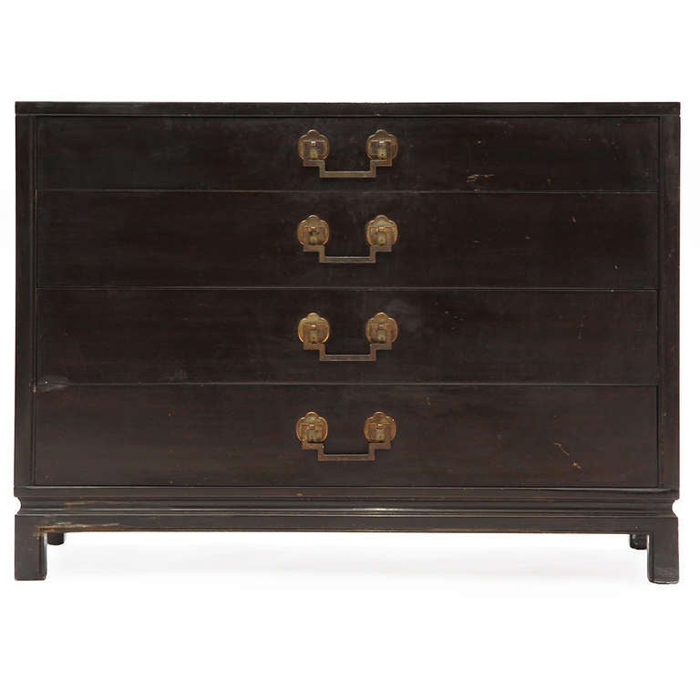 An excellent ebonized mahogany chest of four drawers with decorative bronze pulls.