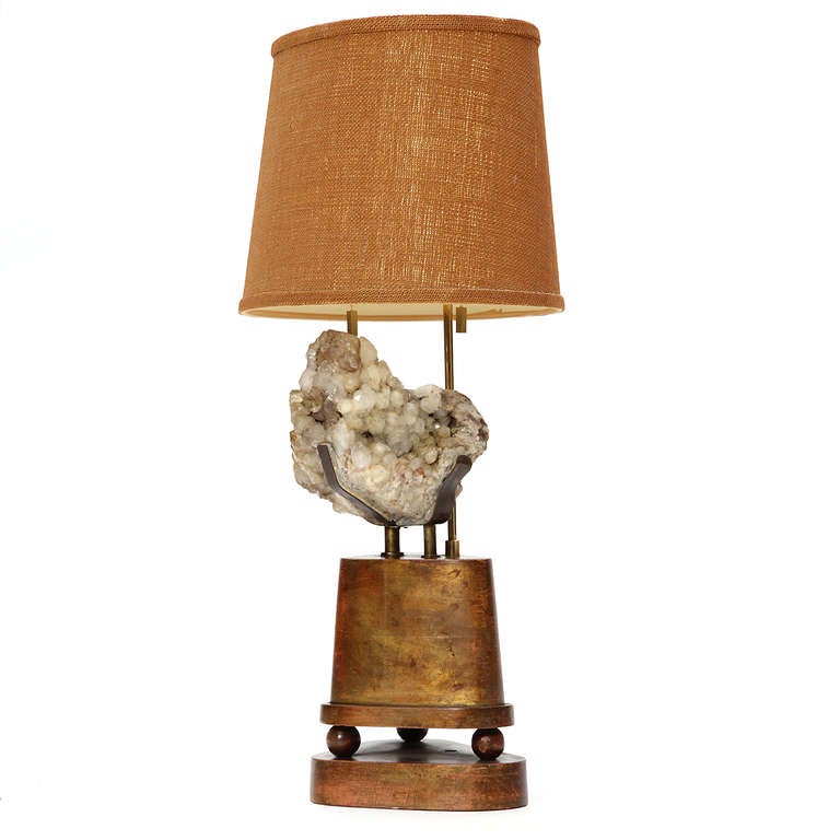 An unusual and interesting table lamp with a pedestal upon a pedestal supporting a bundle of quartz crystals.