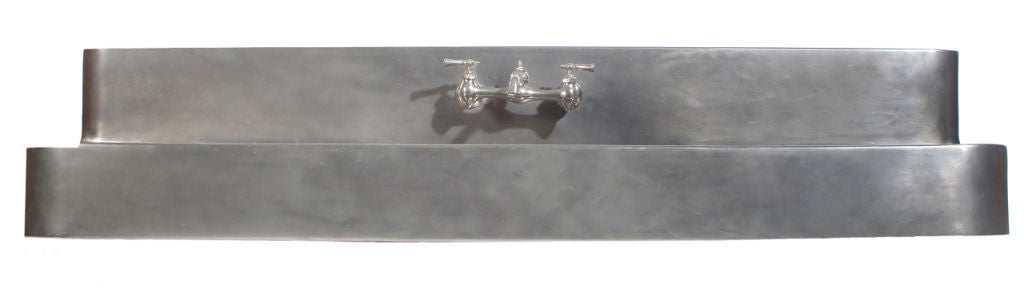 Monel sink with ribbed, draining work surface. Additional Top Edge 2.25