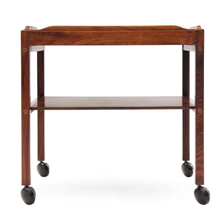 An simple and amazing rosewood cart with a removable tray with inset handmade ceramic tiles.