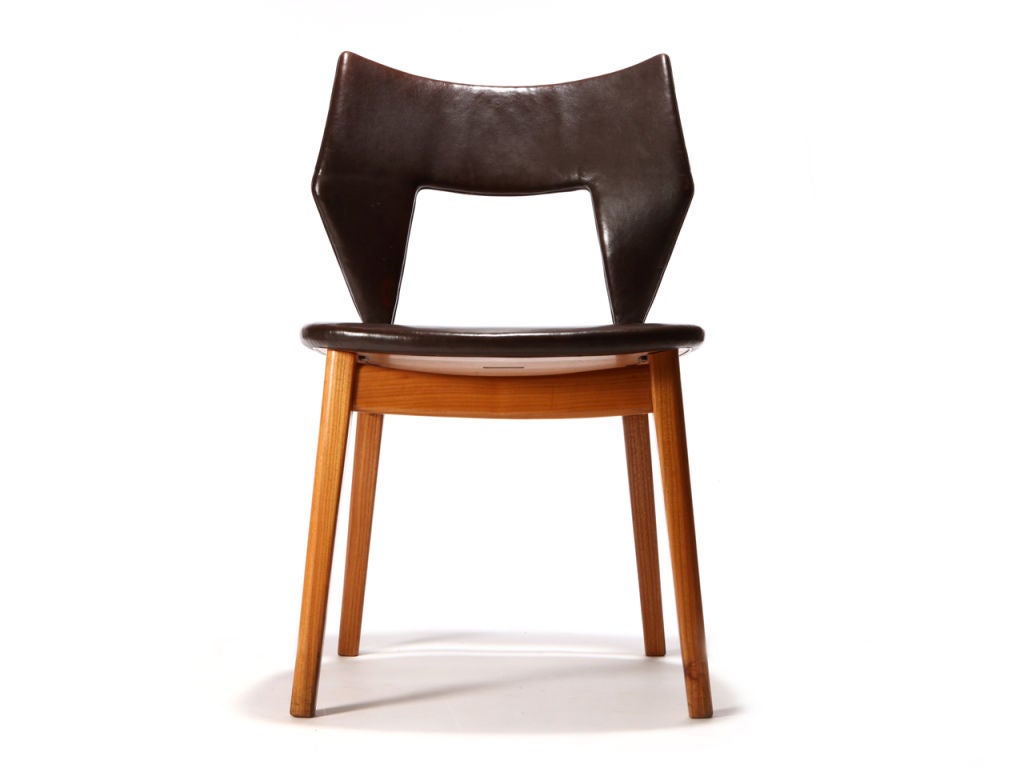 A rare ash dining chair with the original brown leather seat and back finished underside trimmed with leather welting and brass hardware. Designed by Edward and Tove Kindt-Larsen — Made by Thorald Madsens.