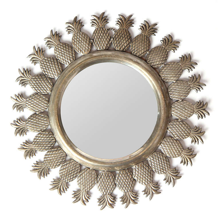 A whimsical, yet beautiful vanity mirror with a frame of twenty-three pineapples.