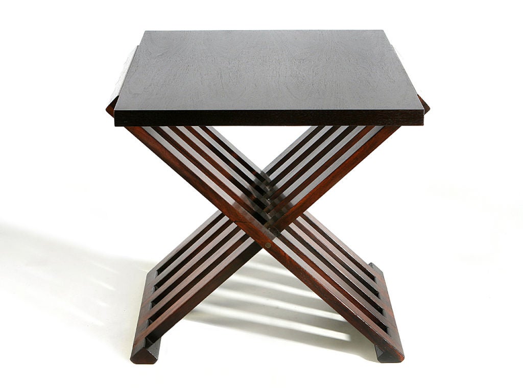 A solid rosewood campaign folding base end table with a dark walnut top. Designed by Edward Wormley for Dunbar 1957