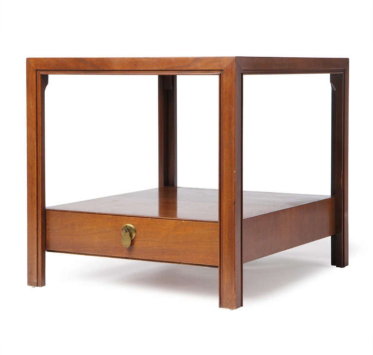 An excellent pair of Parsons style end tables in walnut with a lower shelf containing a single drawer.