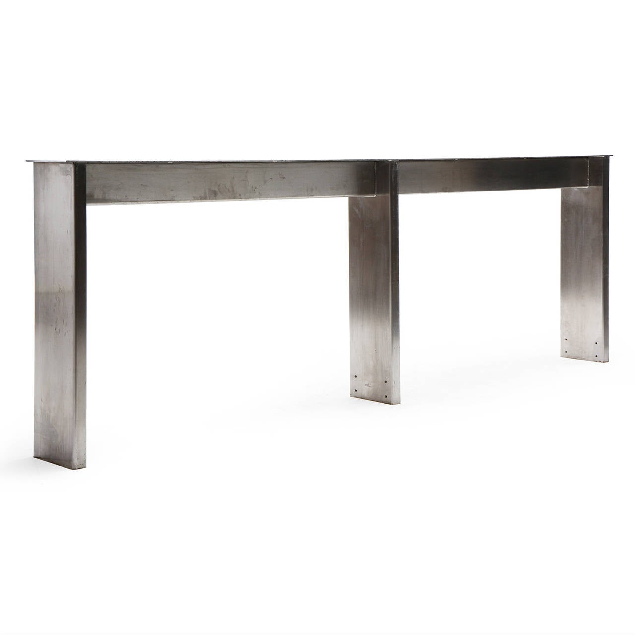 A masterfully fabricated, architectural and generously scaled rectilinear polished steel long and low table from New York's Yankee Stadium.