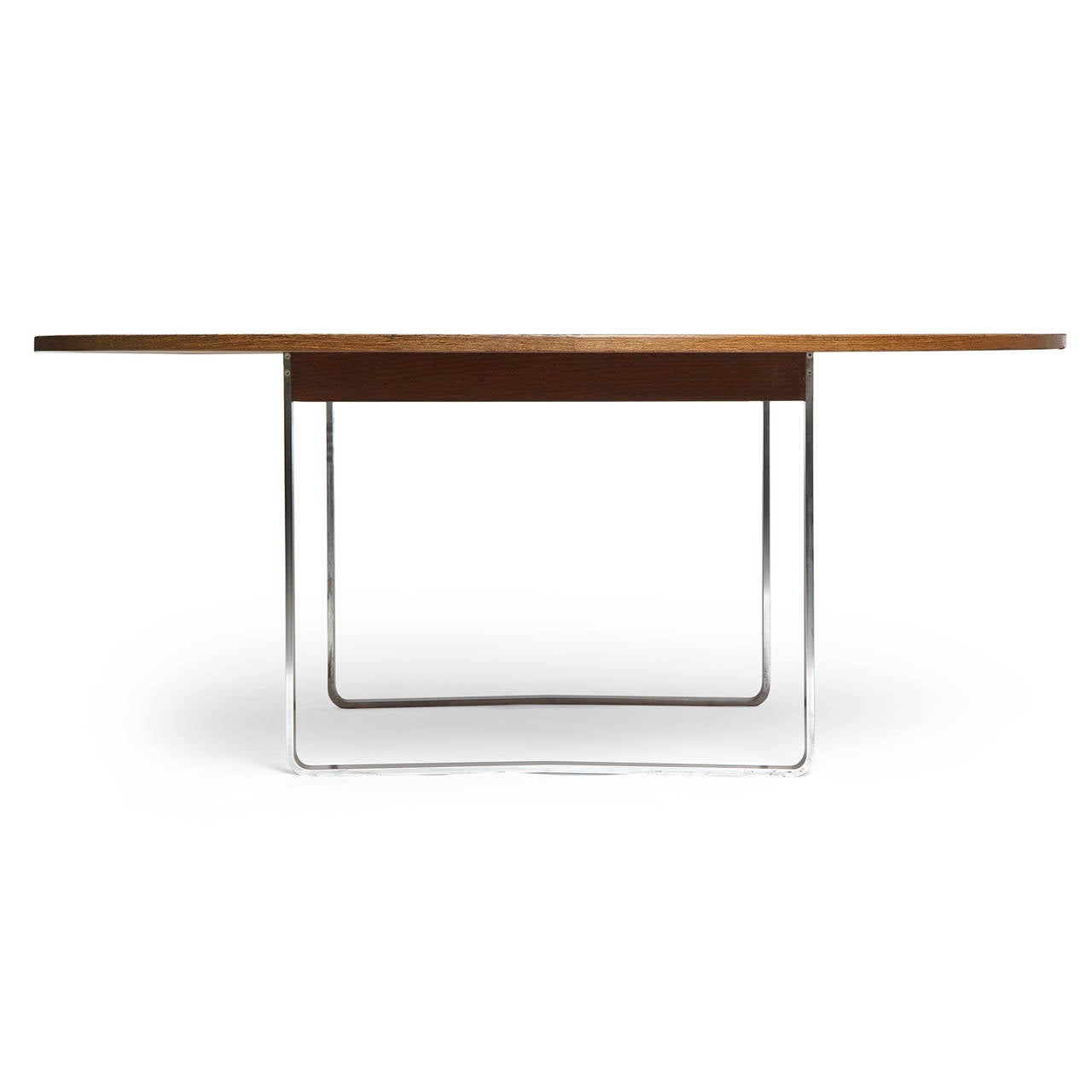 A rare, refined and superb dining or conference table having a circular top of vividly grained wenge floating on an architectural base crafted of continuously looped bands of satin brushed steel.