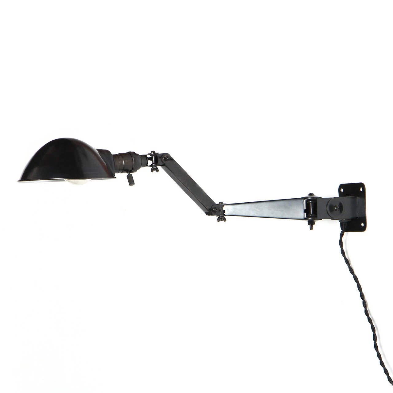 A pair of finely fabricated and highly adjustable articulated patinated steel wall mount lamp having a round pivoting shade.
