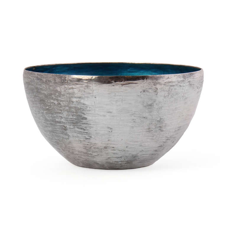 A beautiful handmade sterling silver bowl with a translucent blue enameled interior. Hallmarked with makers mark, designer, year and 925.