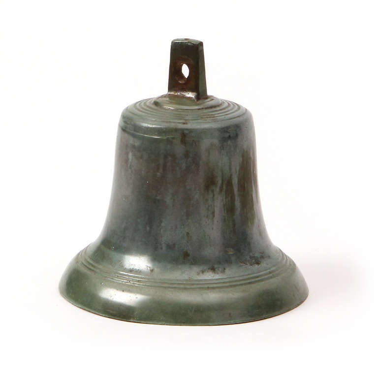 A cast bronze bell with a polished Verdigris patina and a steel clapper.