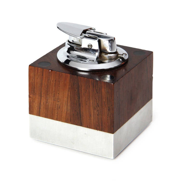 A simple and modernist cube shaped desktop lighter executed in Brazilian rosewood and brushed aluminum. Stamped on bottom 