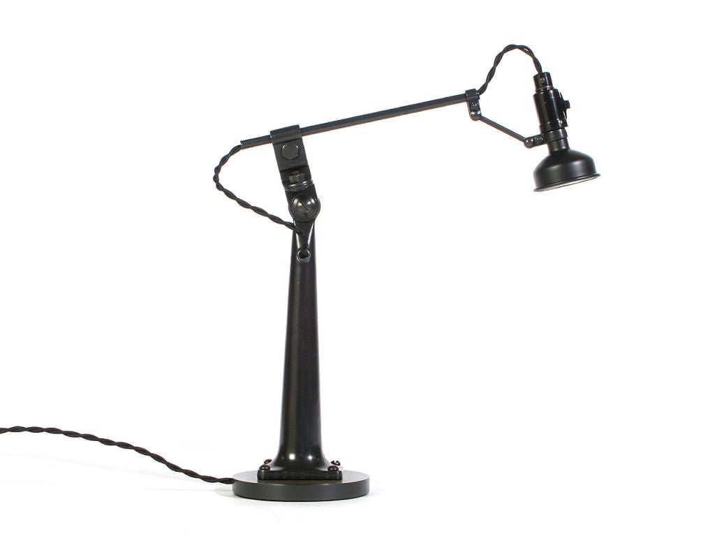 Fully positionable table or desk lamp provides task and reading light