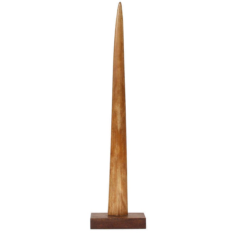 A large and well-proportioned swordfish bill mounted onto a rectangular walnut base.