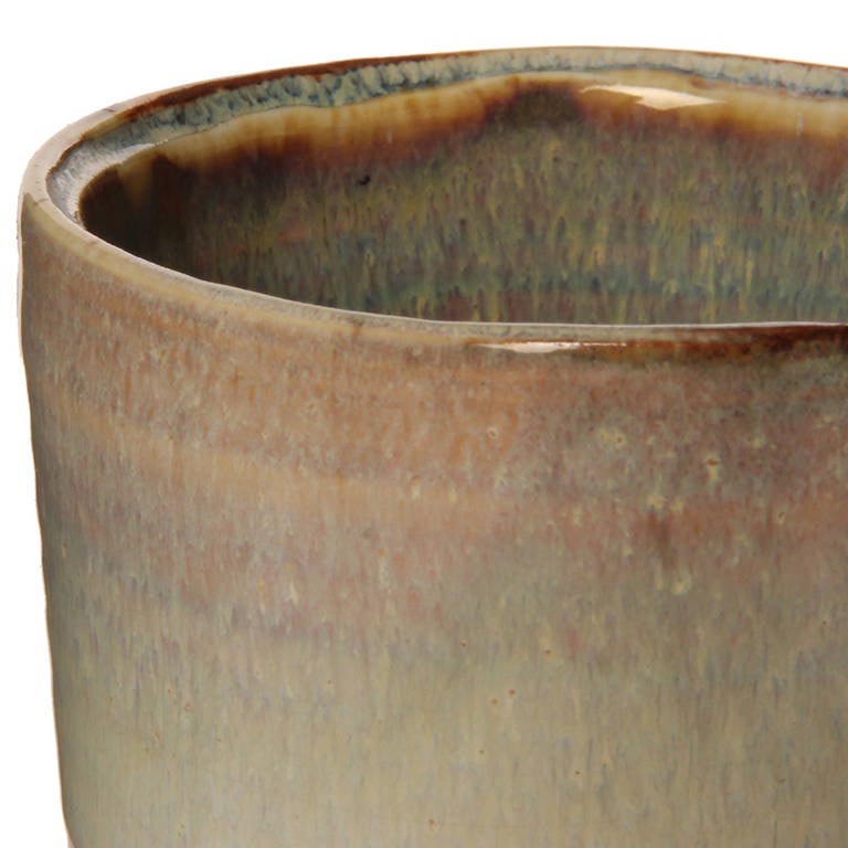 An excellent ceramic cup with a white glaze and brown undertones. Made by Schilkin while working for Arabia of Finland. Marked 