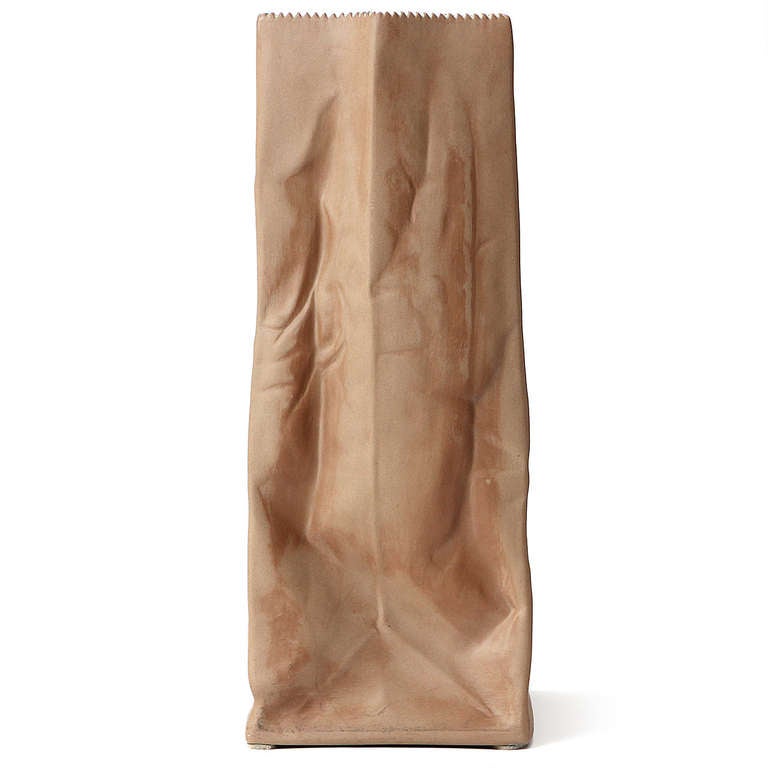 A striking and rare life-sized trompe l'oeil paper bag vase rendered in porcelain.