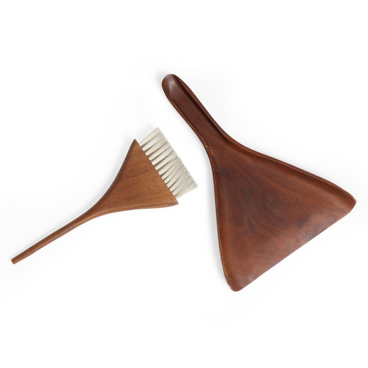 A fine table brush set hand crafted of teak, the brush having fine boar bristles.