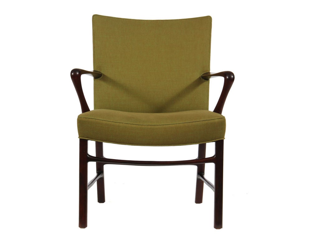 A pair of exceptional mahogany armchairs with olive silk and cotton twill upholstery