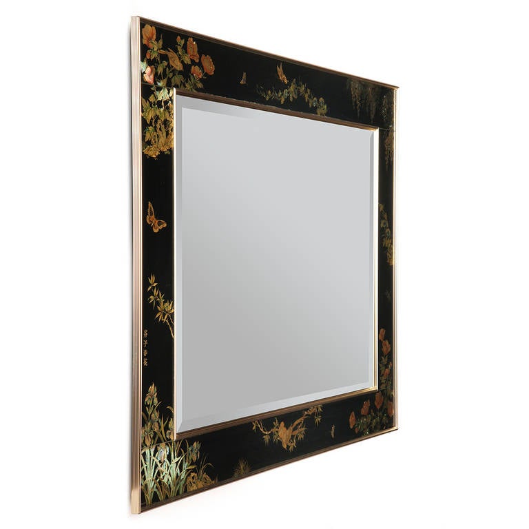 An elegant rectangular wall mirror designed by T. Uandyke featuring beautiful hand painted flora and fauna on a wide black glass frame. Artist-signed, made by La Barge in the USA, circa 1985.