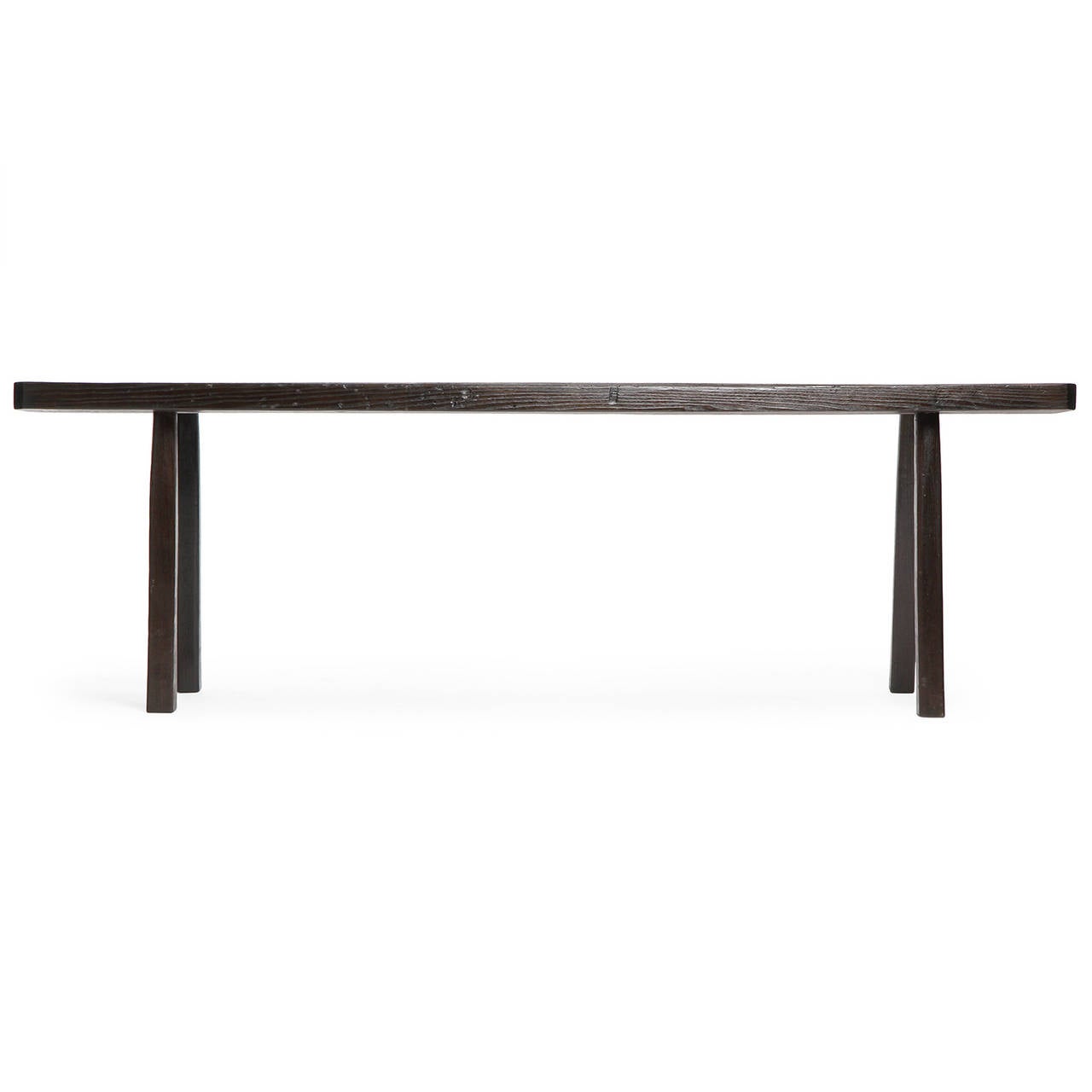 An ebonized oak console table with textured grain and through tenon splayed legs.