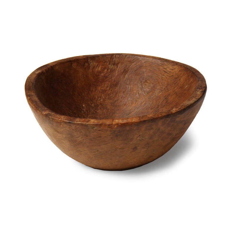 A wonderful primitive antique bowl carved from a single piece of old growth elm burl. Marked with a star on the bottom.