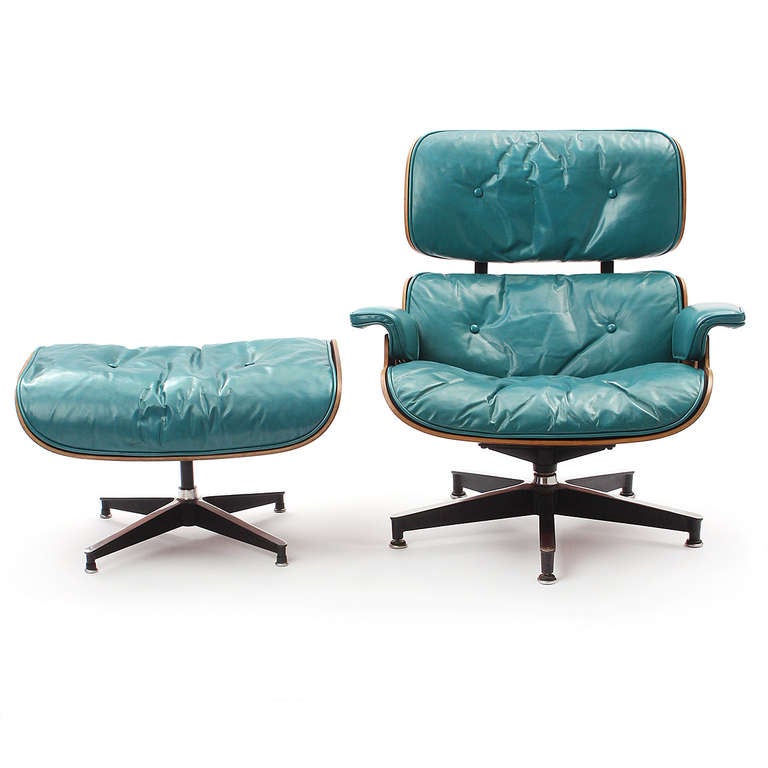 A beautiful and rare example of the Eames's iconic lounge chair and ottoman in richly grained rosewood with custom-ordered emerald leather upholstery.