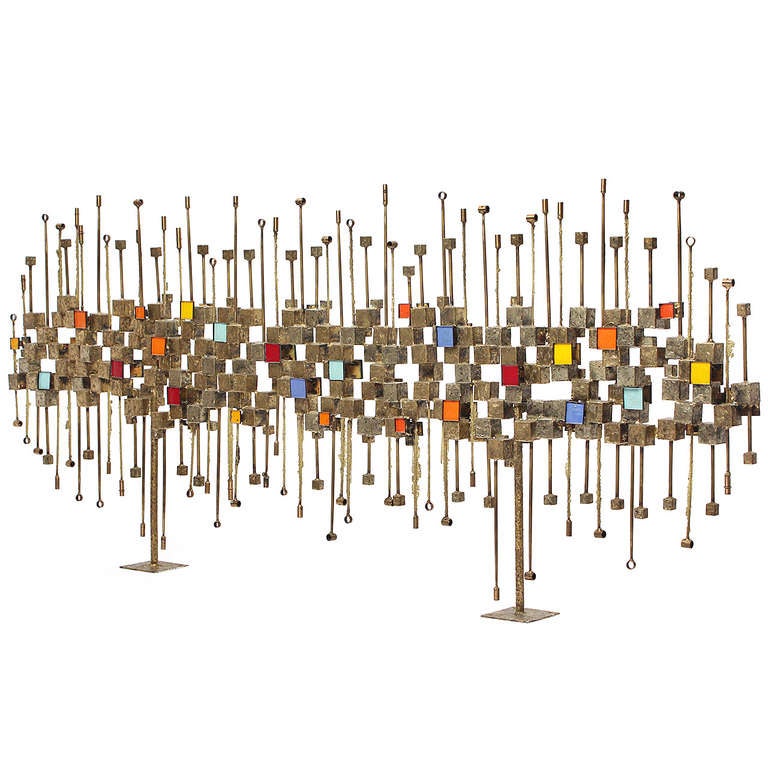 A fantastic, exuberant and unique double-sided sculpture (that can be used as a screen or room divider) comprised of welded bronze rods and punctuated by richly hued enameled squares and well-delineated negative spaces.