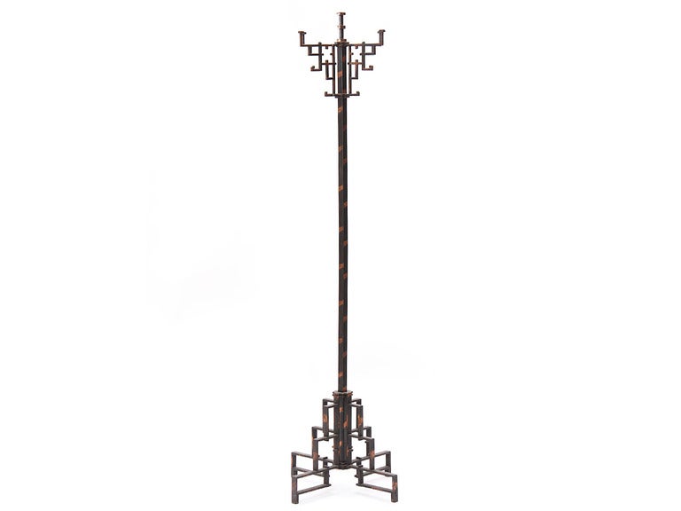 A copper flash plated steel coat tree with twelve hooks, in a rectilinear 