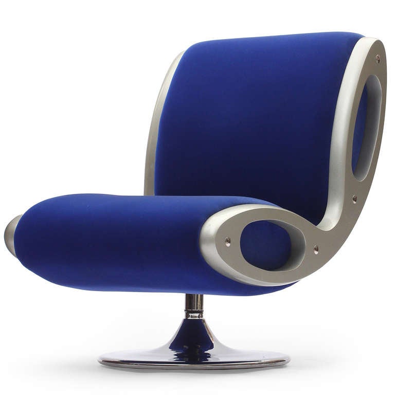 A set of futuristic and finely constructed swiveling Gluon lounge chairs designed by Marc Newson, each having chromed pedestal bases, seats and backs of steel covered with injected foam, and sides made of lacquered polyurethane.