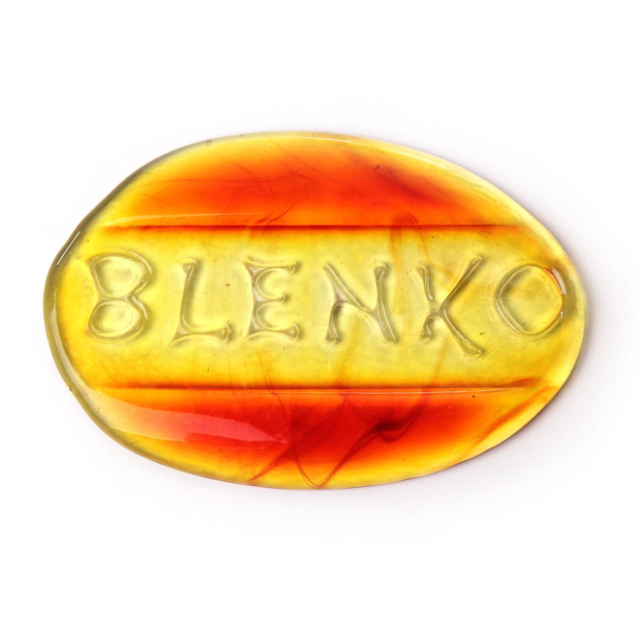 An uncommon and handmade glass desk weight in luminous tones of amber and red advertising the Blenko Glass works.