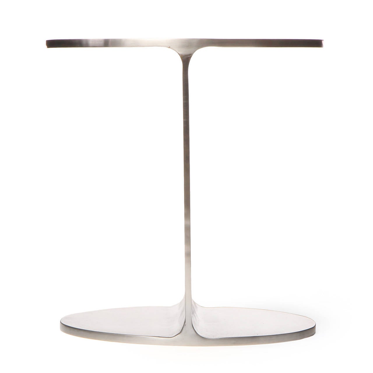 A superbly rendered and sublimely minimalist pedestal, side table or coffee table in the form of a truncated I-beam fashioned of hot rolled and welded steel with a polished natural grain surface. This versatile table can be left bare or topped with
