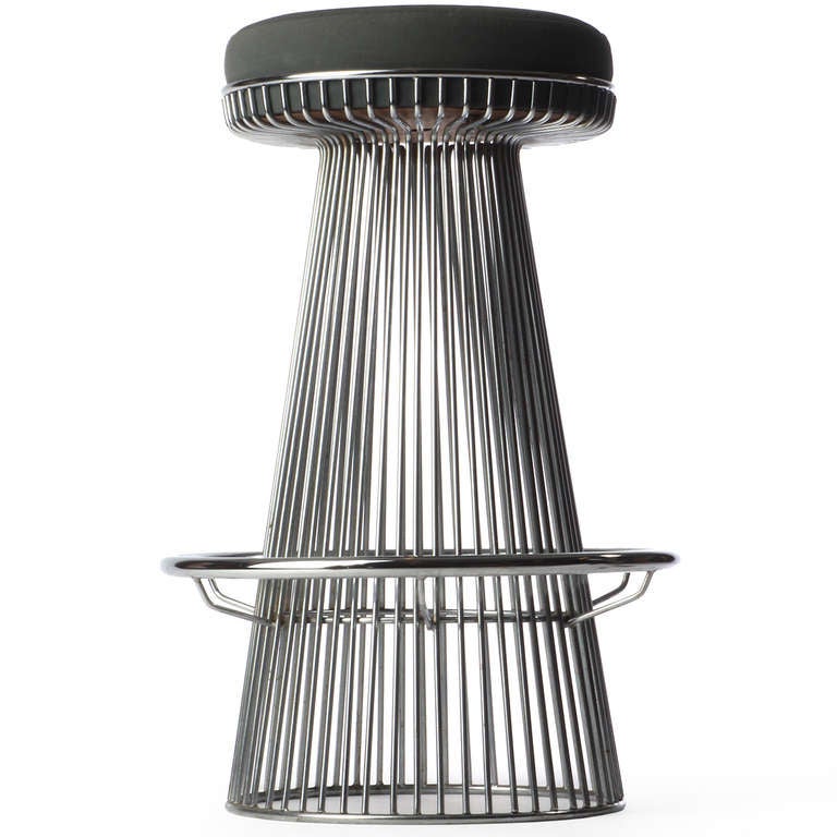 A good set of sculptural bar stools fashioned from dramatically shaped chromed rods encasing a 14