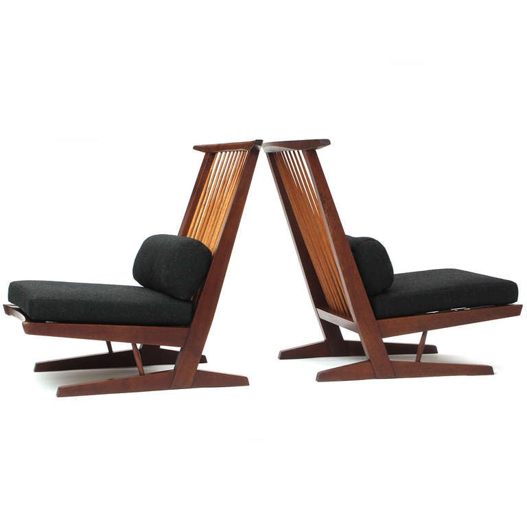 A superb and early pair of studio-made Conoid lounge chairs in black walnut having cushions upholstered in a rich charcoal wool.