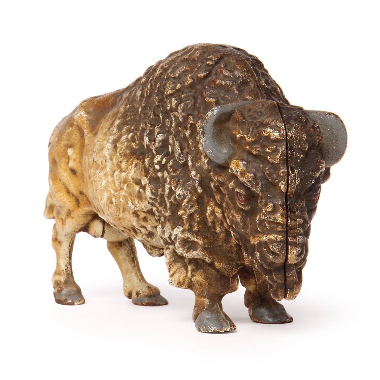A beautifully modeled cast iron bison still bank that retains much of its original polychrome surface.