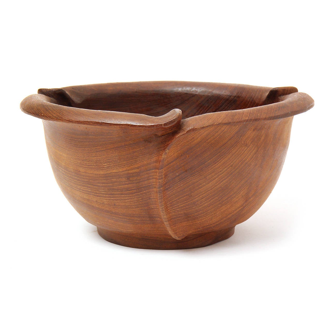 An interesting and finely crafted undulating and scalloped bowl made from a solid block of figured walnut.