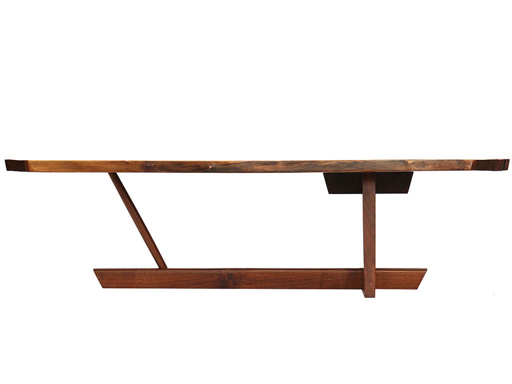 A free-edge walnut low table with butterfly spline. Could also be used as a bench.