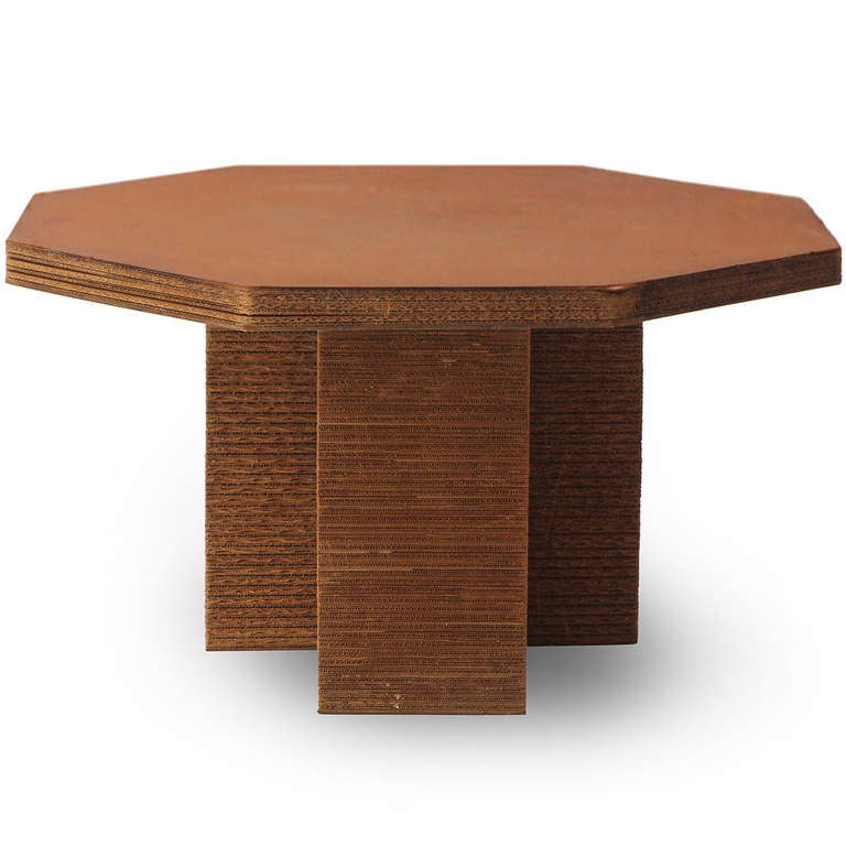 From architect Frank Gehry's iconic corrugated cardboard Easy Edges series, a rare gaming table having an octagonal top that rests upon three square columns.