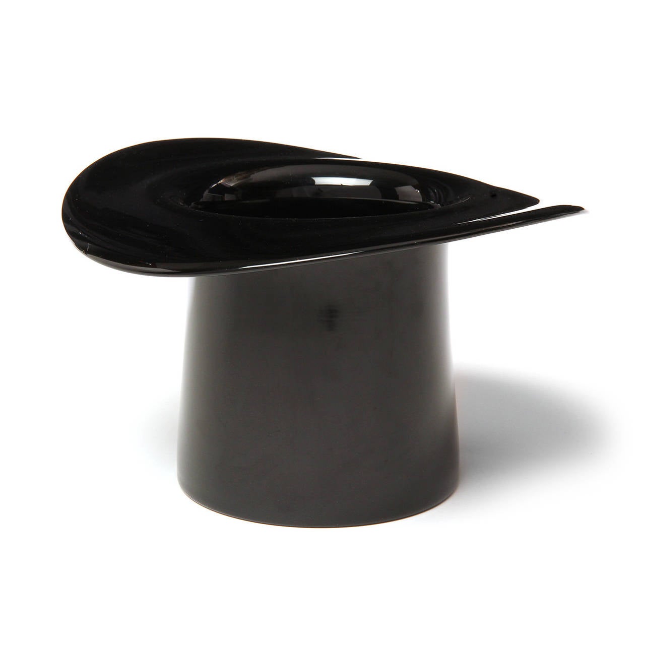 A delightful and finely rendered mouth-blown unique top hat crafted of black glass and useful as a sculpture, vase or champagne cooler.