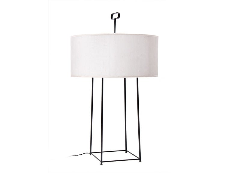 An open tubular patinated brass table lamp with 